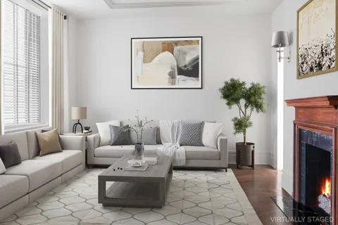 a living room with furniture a couch and a fireplace