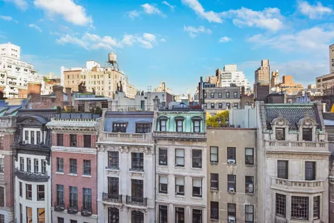 a view of a city with tall buildings