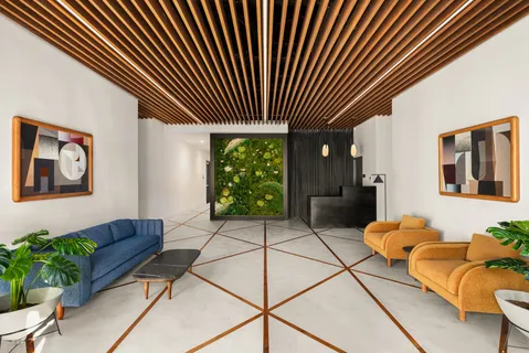 a living room with furniture and a potted plant