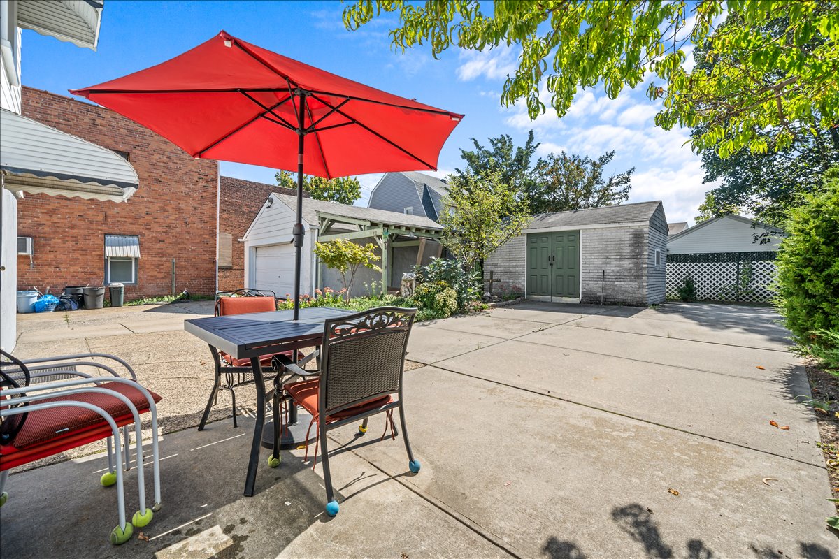100-14 159th Avenue Queens, NY 11414 - Photo 3 of 26 a backyard of a house with table and chairs
