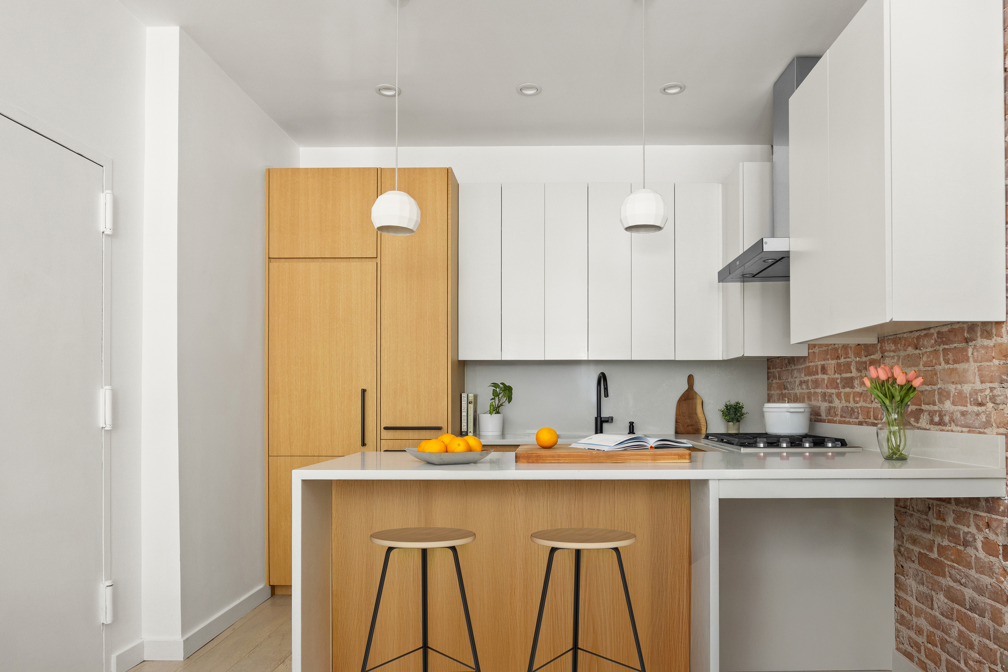 a kitchen with a sink cabinets and window