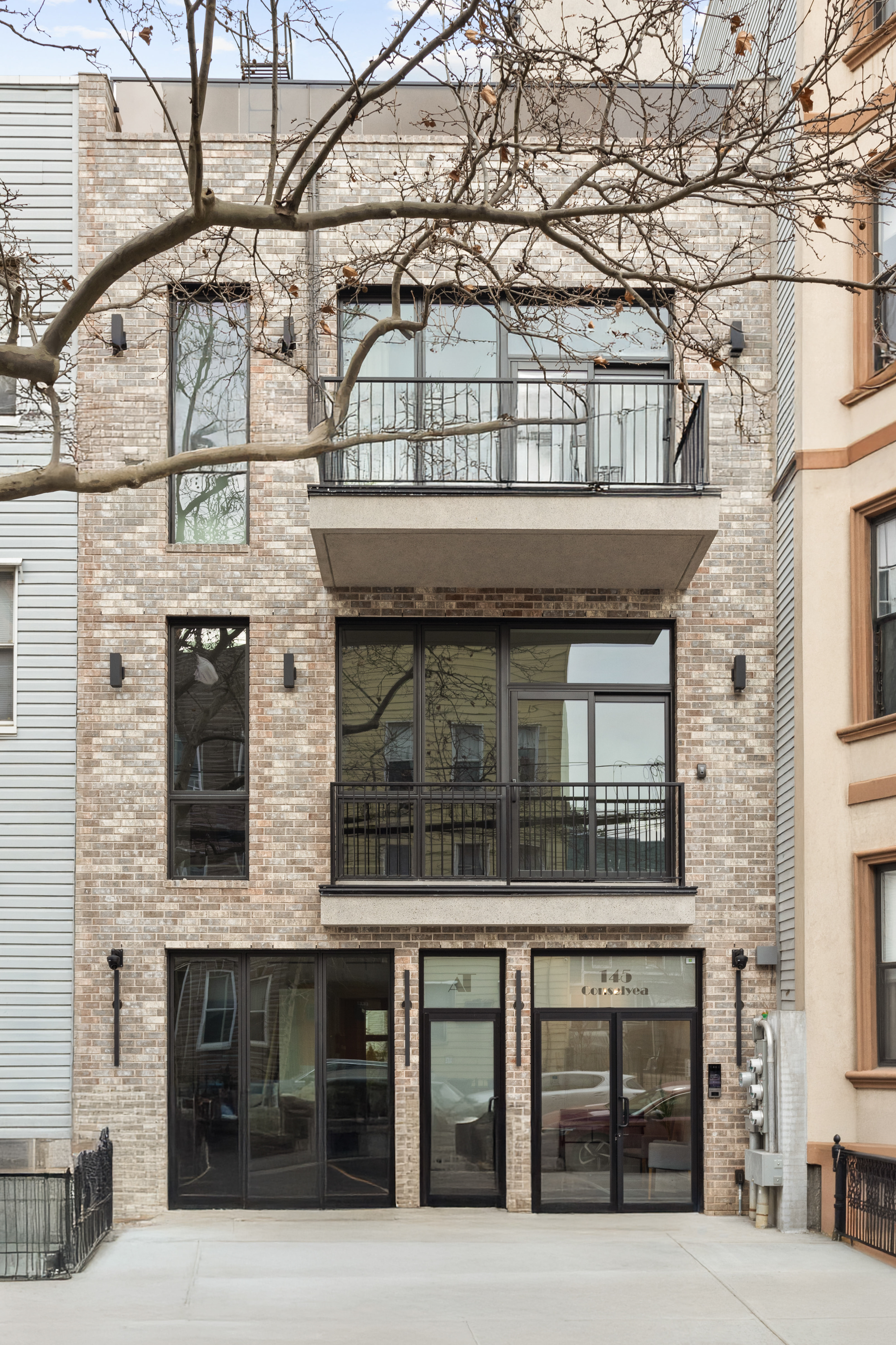 145 Conselyea Street Brooklyn, NY 11211 - Photo 10 of 15 a building with a window and balcony