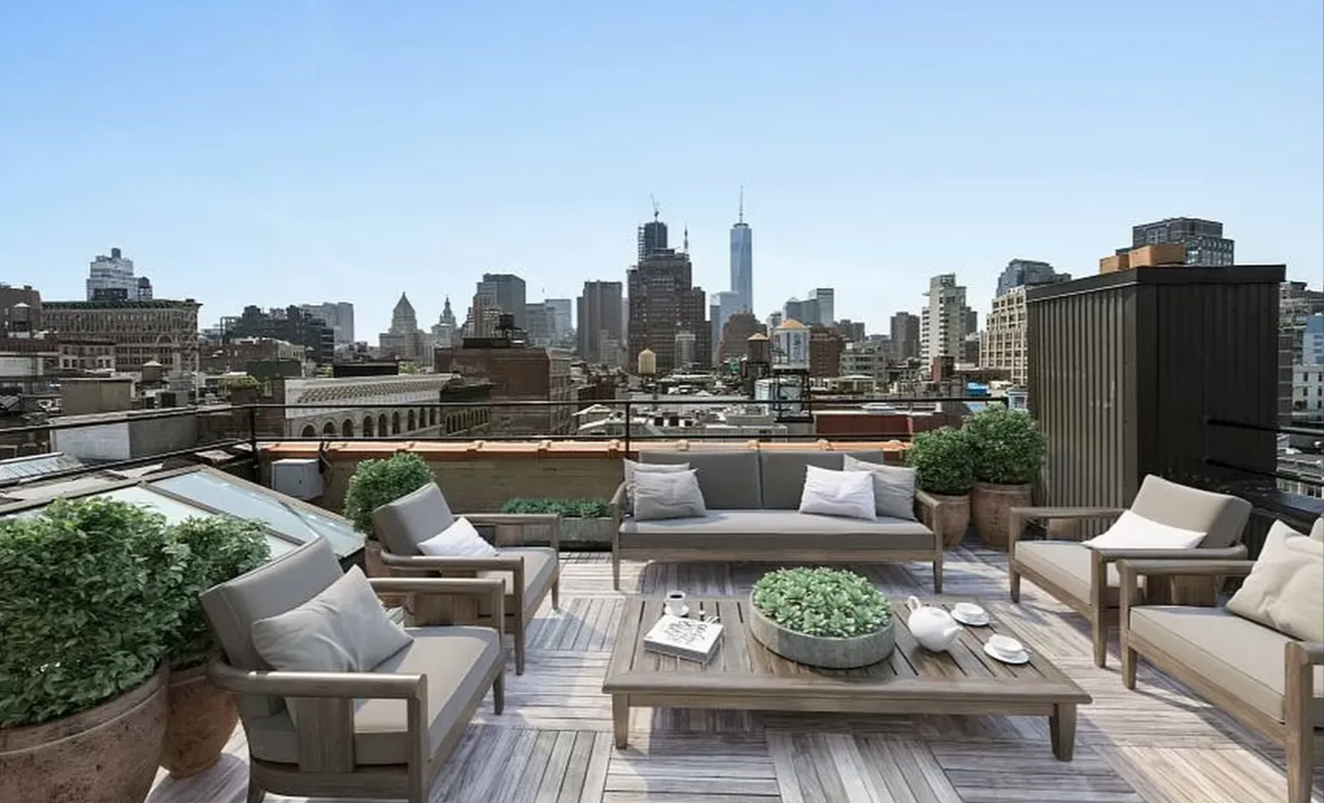 145 Spring Street, Unit PH Manhattan, NY 10012 - Photo 7 of 10 a view of a roof deck with couches and potted plants