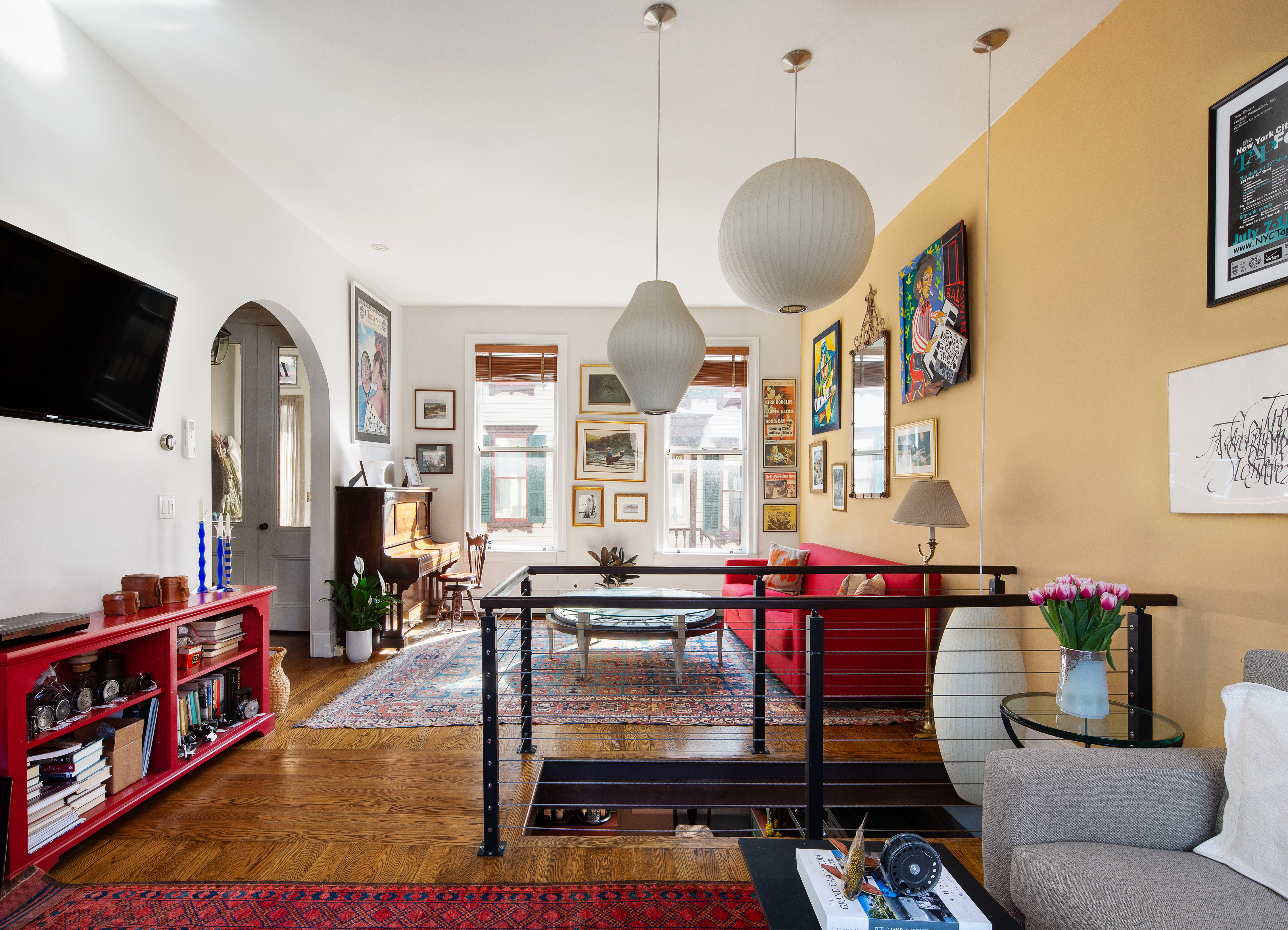 11 Sylvan Terrace Manhattan, NY 10032 - Photo 4 of 16 a living room with furniture a flat screen tv and a window