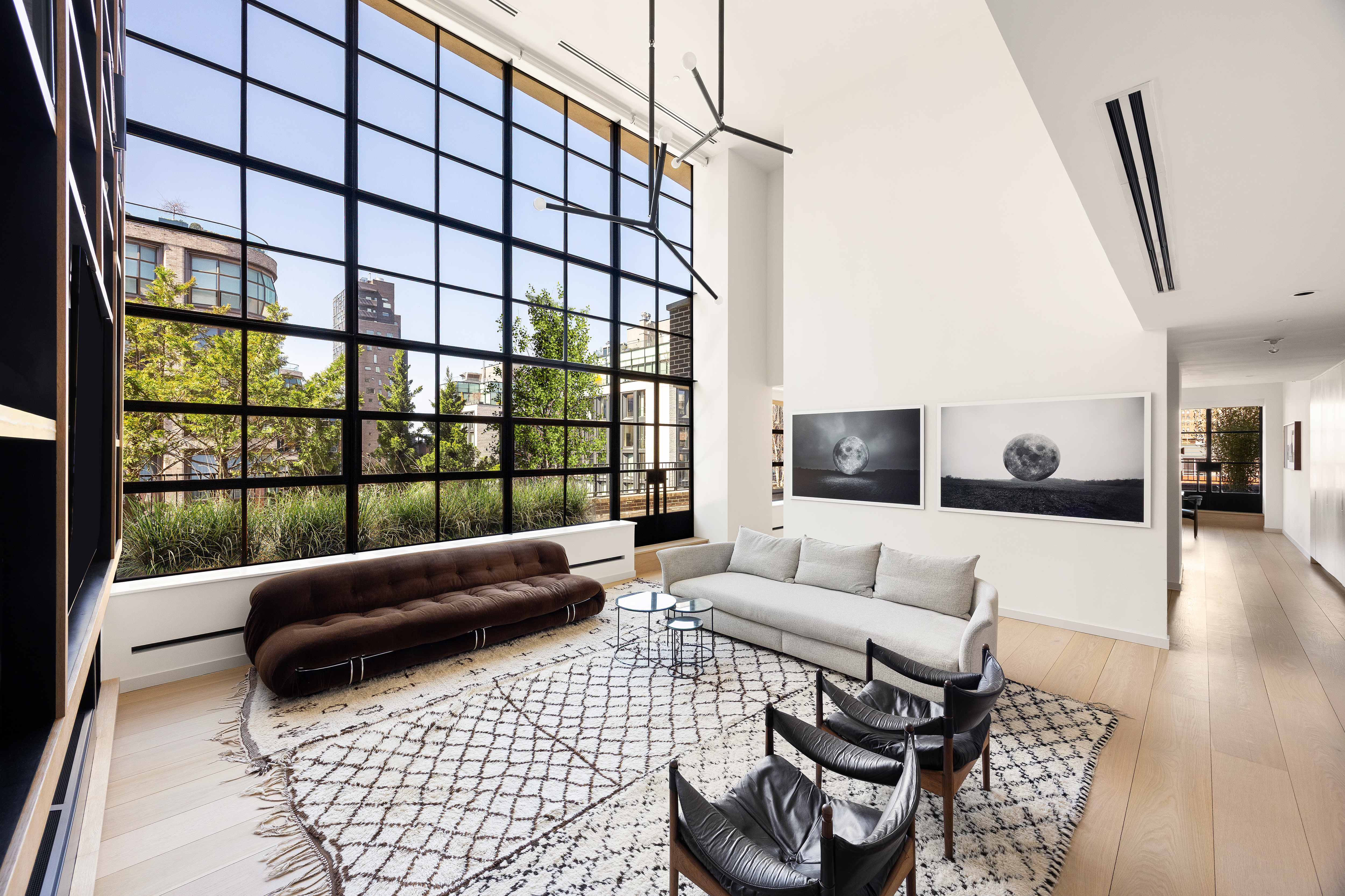 456 West 19th Street, Unit PHH Manhattan, NY 10011 - Photo 1 of 15 a living room with furniture and a window