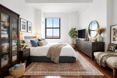 a bed room with bed and wooden floor