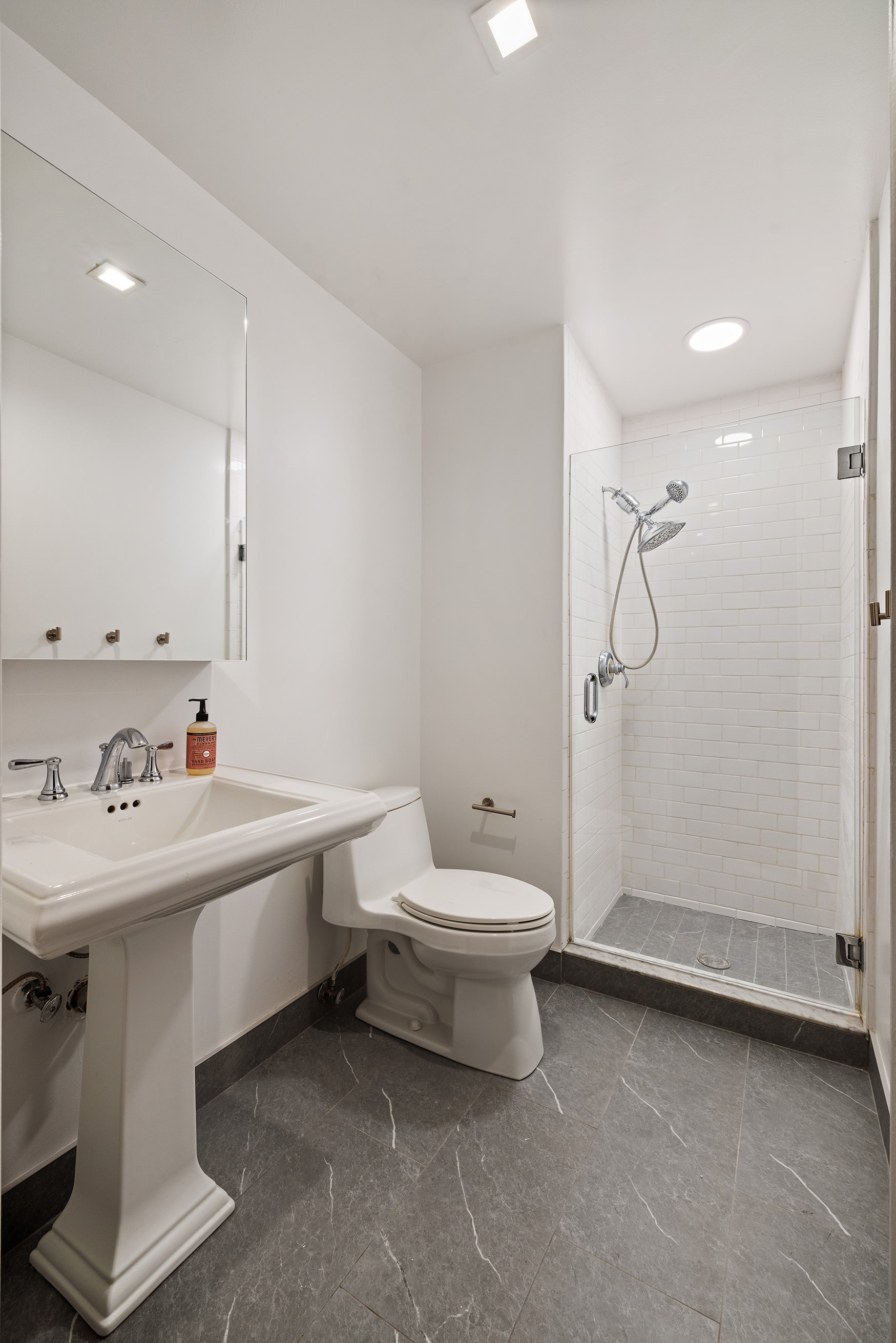 17 Murray Street, Unit 3 Manhattan, NY 10007 - Photo 11 of 12 a bathroom with a sink toilet and shower