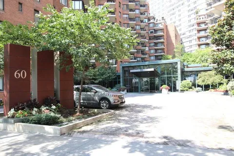 a view of a car park in front of house
