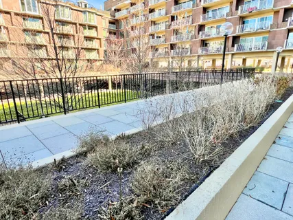 a view of a house with pool and chairs