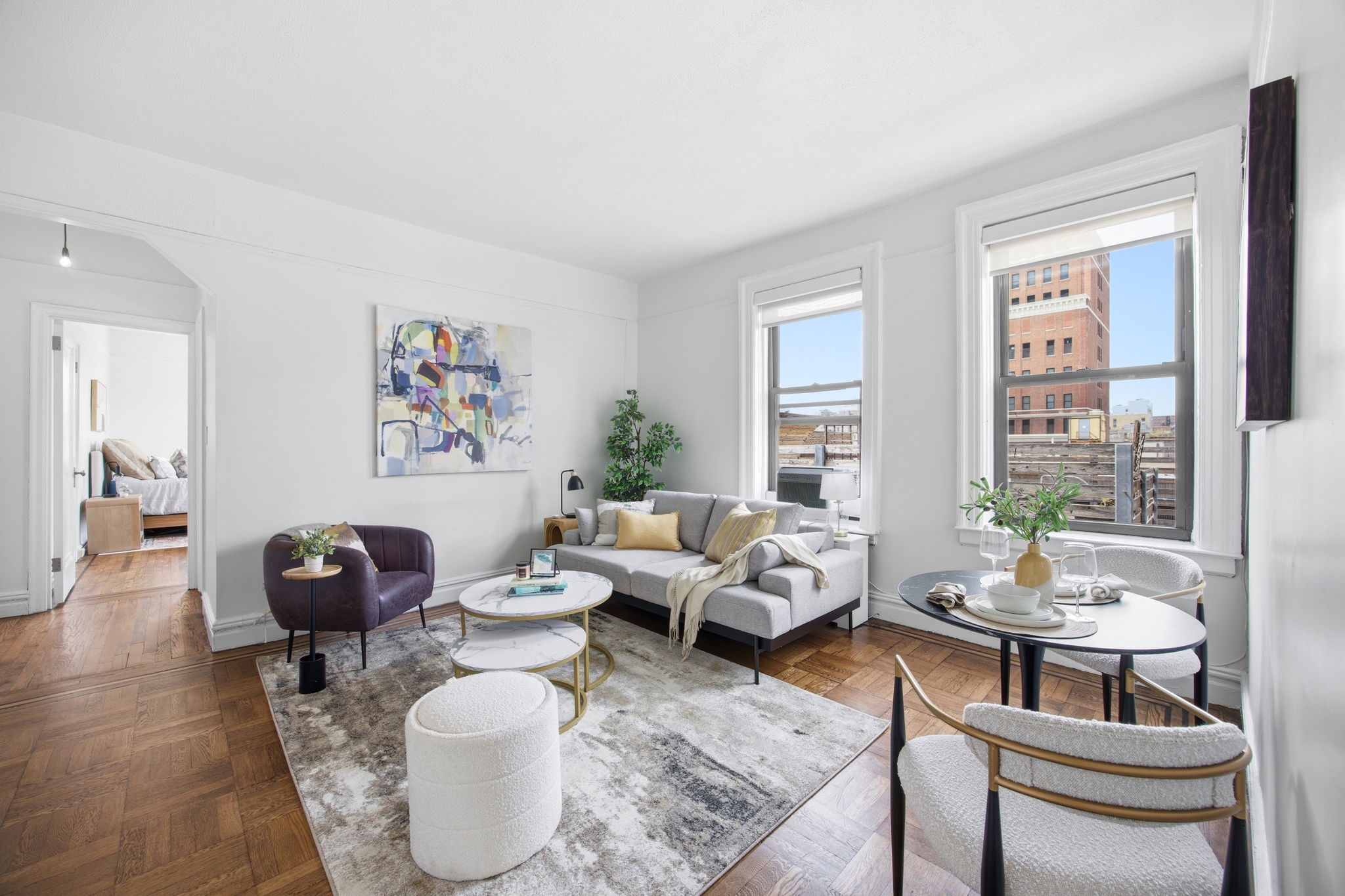 a living room with furniture and a large window