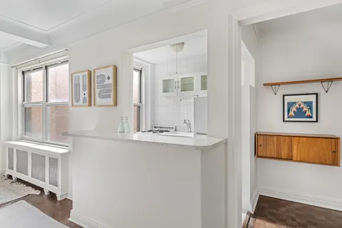 a view of living room with furniture and window