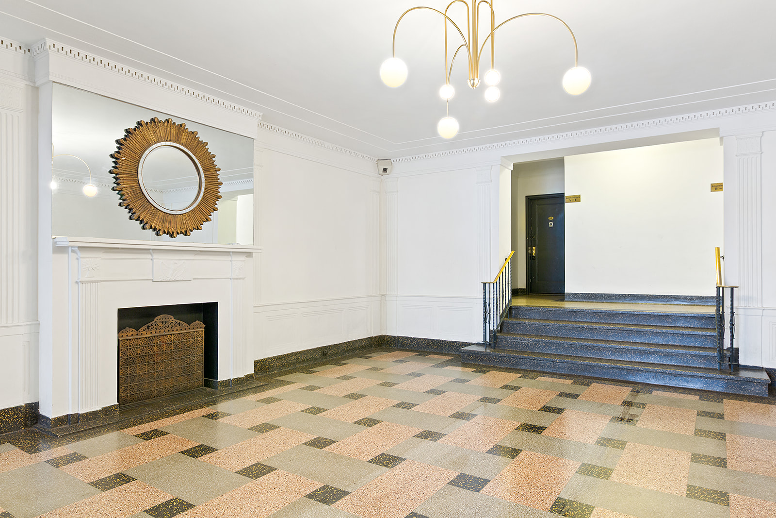 811 Cortelyou Road, Unit 2L Brooklyn, NY 11218 - Photo 8 of 10 a view of a livingroom with wooden floor and a fireplace