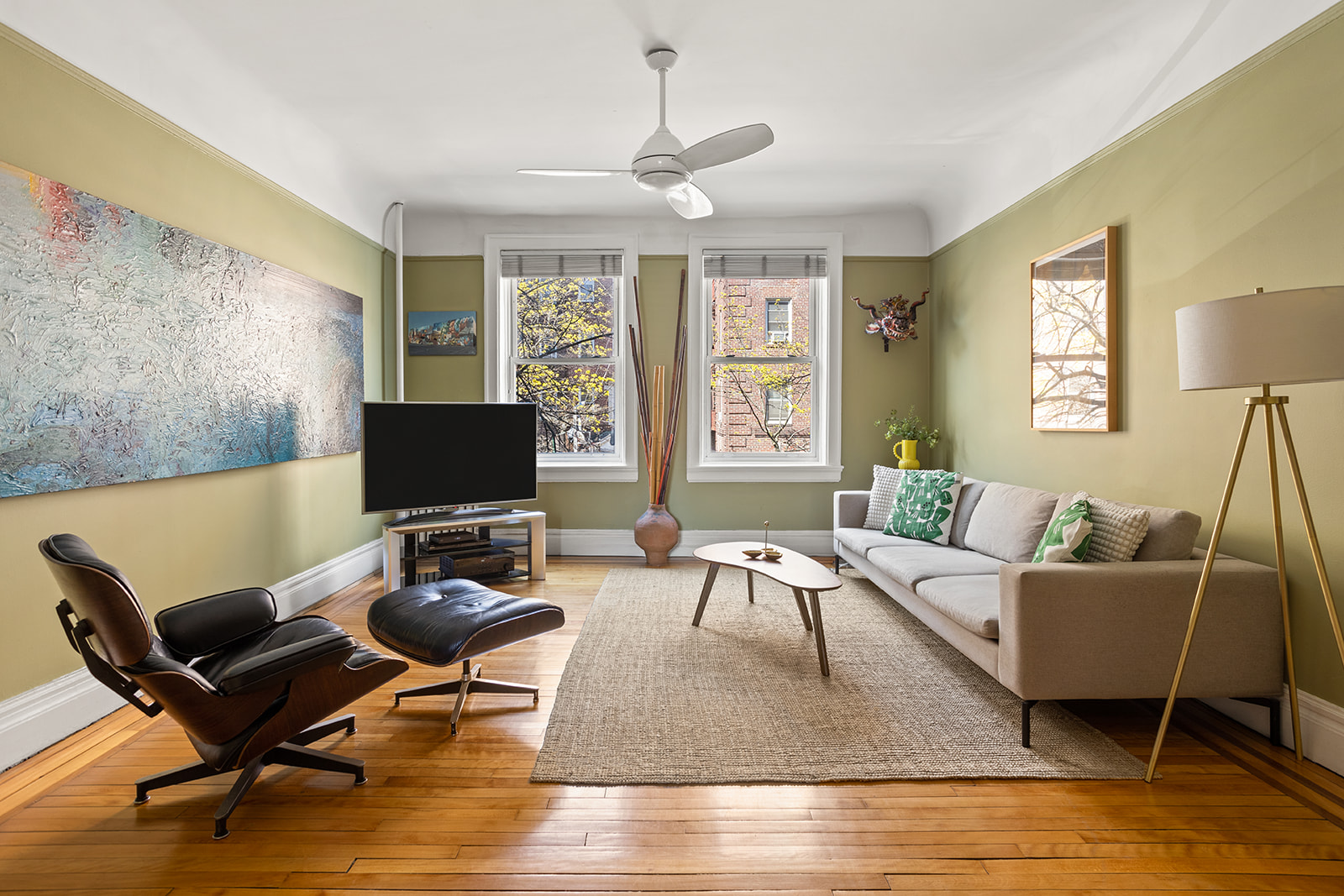a living room with furniture rug and a window