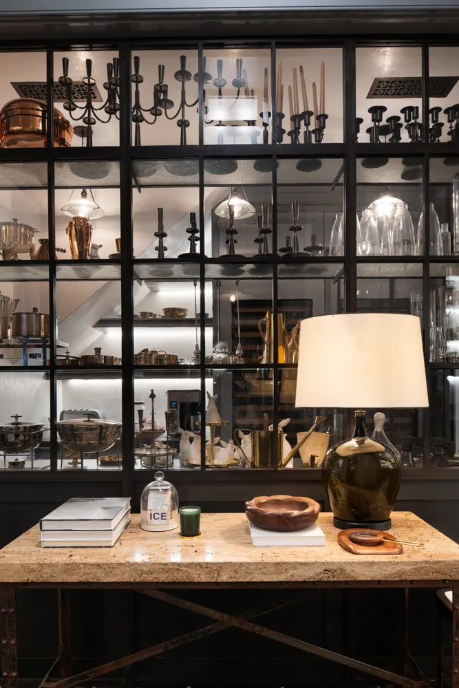 a table with wine bottles and glasses on it