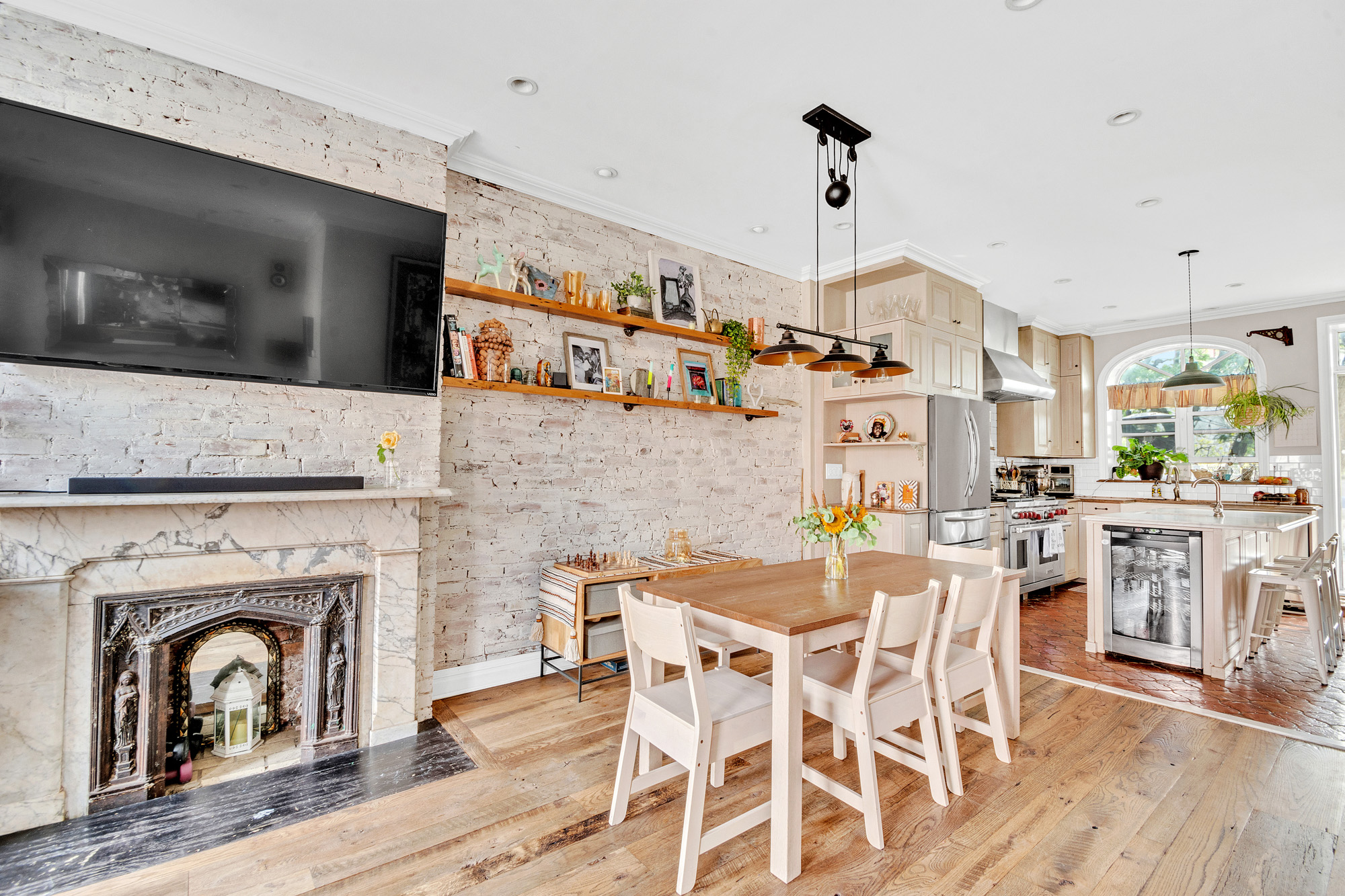 10 Carroll Street Brooklyn, NY 11231 - Photo 4 of 28 a dining room with furniture a fireplace and wooden floor