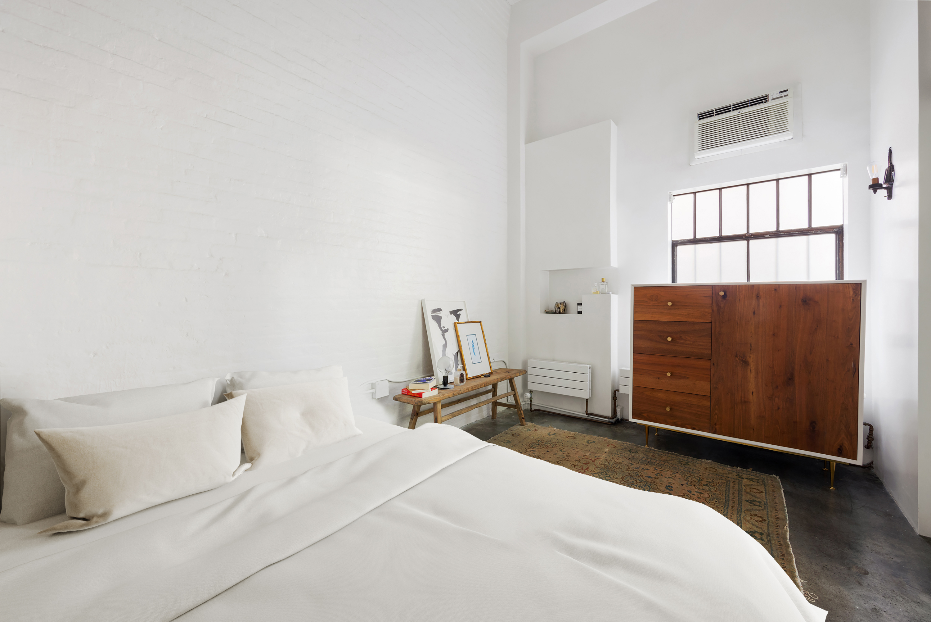 125 Watts Street, Unit 1 Manhattan, NY 10013 - Photo 13 of 24 a bedroom with a bed and a dresser