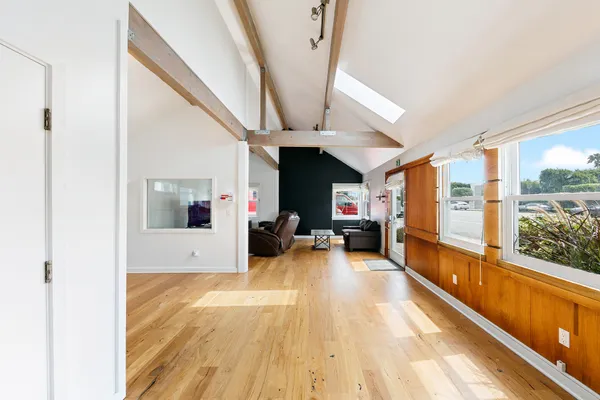 a view of living room with furniture and a large window