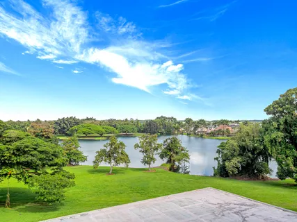 a view of a lake with a big yard