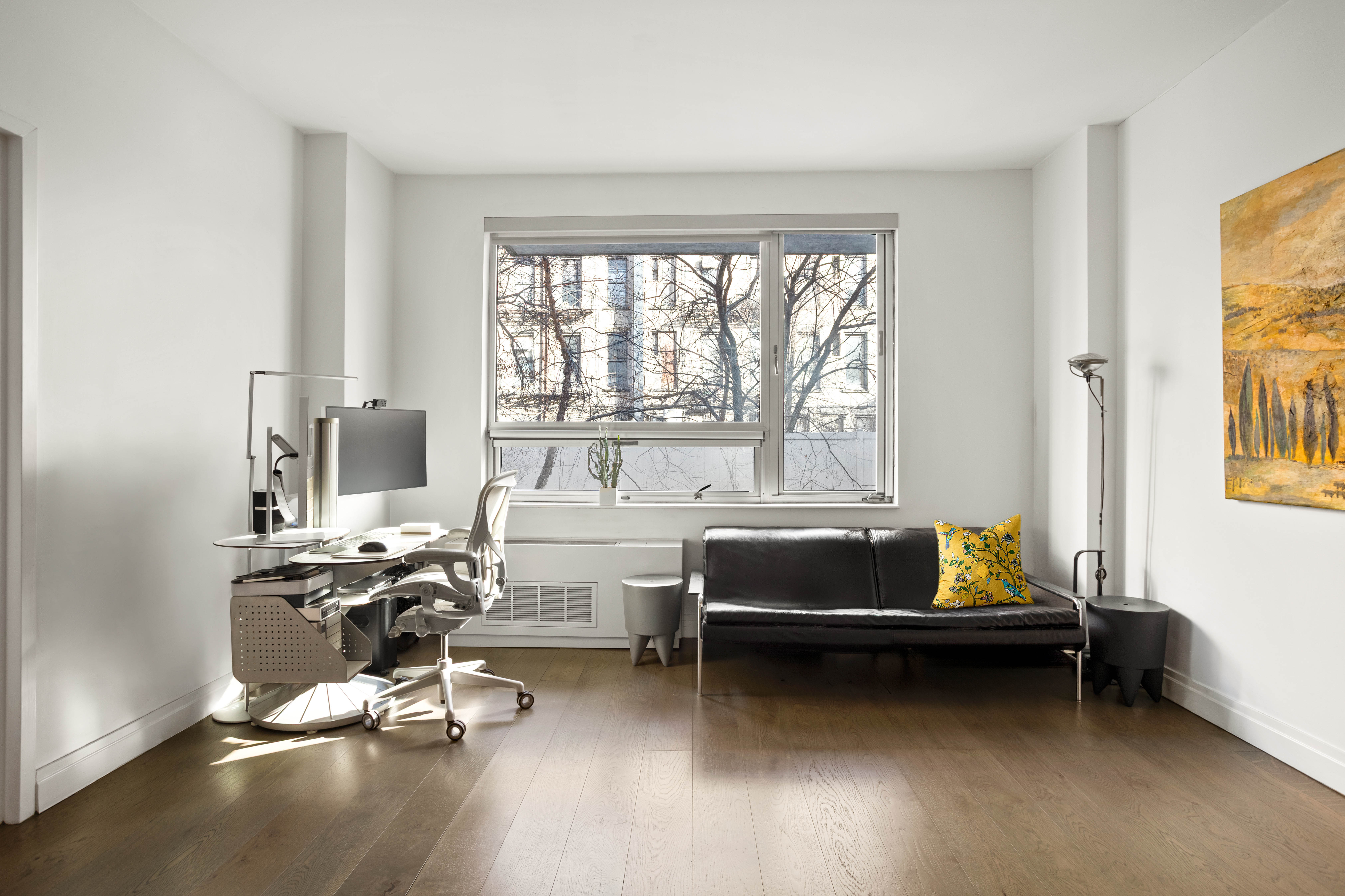 517 West 46th Street, Unit 205 Manhattan, NY 10036 - Photo 2 of 6 a living room with a bed furniture and a window