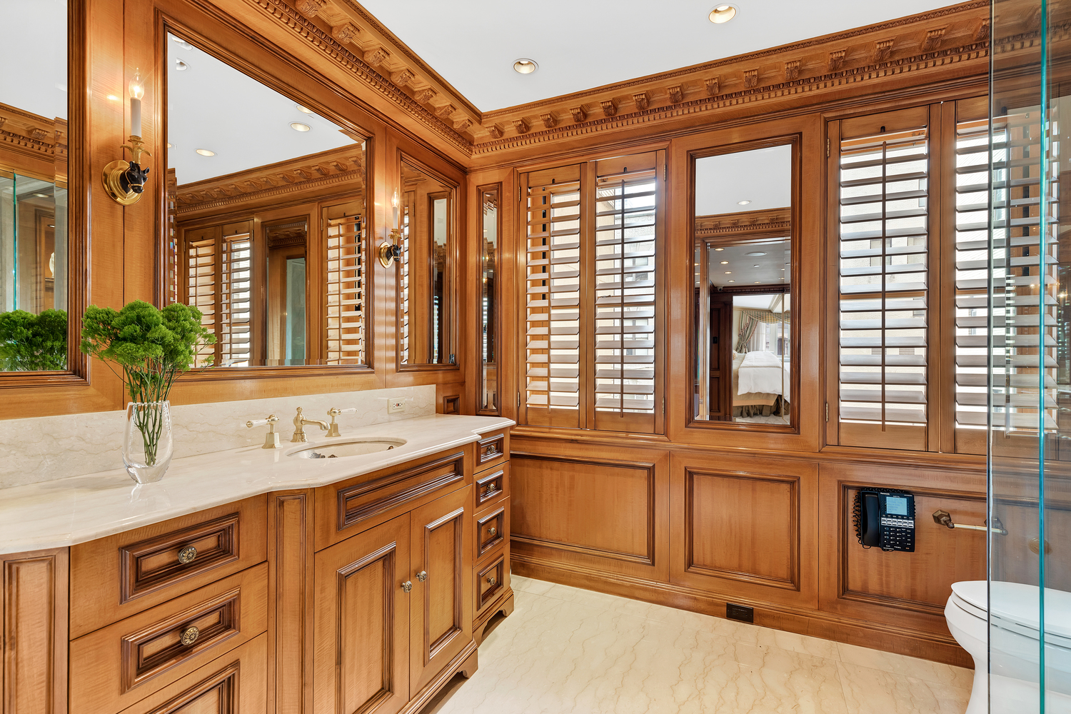 838 5th Avenue, Unit 6 Manhattan, NY 10065 - Photo 15 of 23 a bathroom with a granite countertop sink and large window