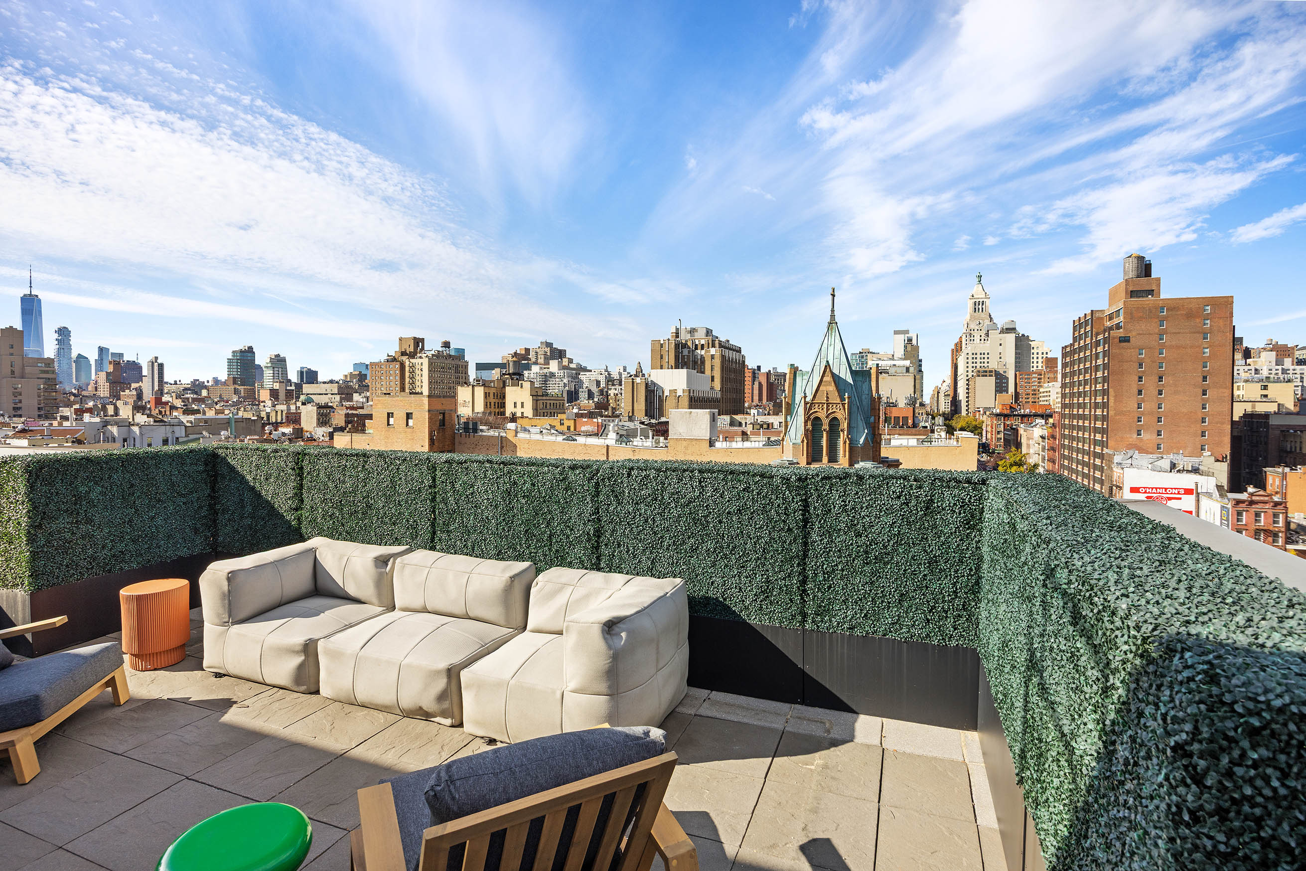 425 East 13th Street, Unit PHFG Manhattan, NY 10009 - Photo 25 of 31 a view of a terrace with couches and a table