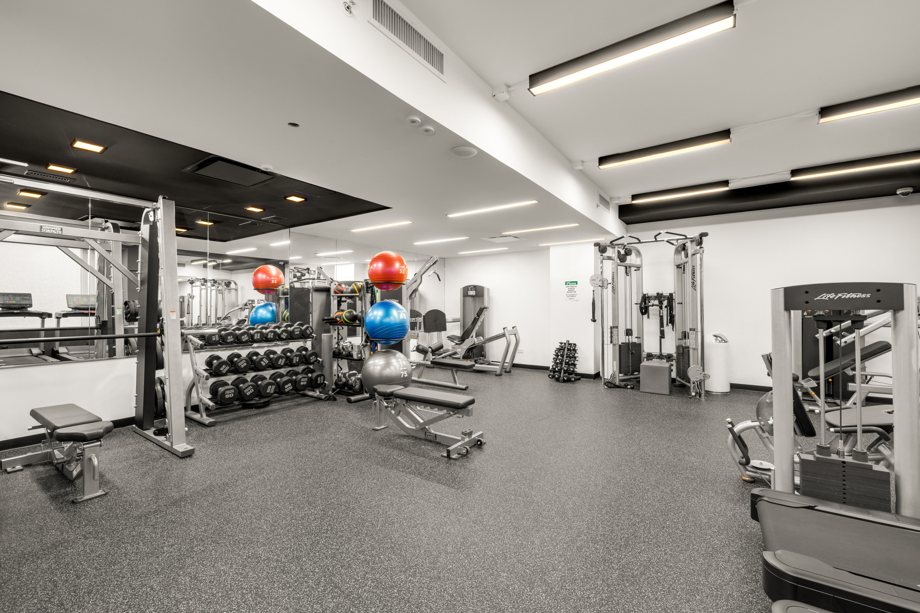 330 Spring Street, Unit 5C Manhattan, NY 10013 - Photo 10 of 18 a view of a room with gym equipment