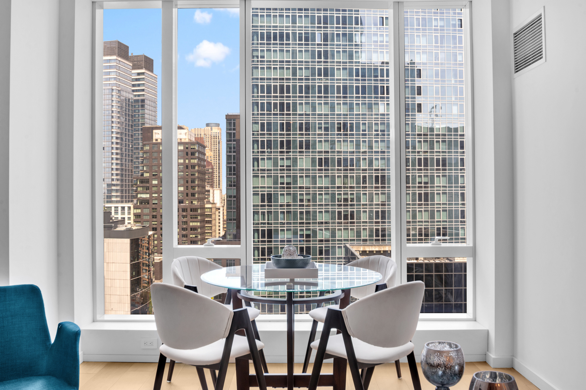 1 West End Avenue, Unit 16L Manhattan, NY 10069 - Photo 7 of 11 a view of a dining room with furniture and chandelier