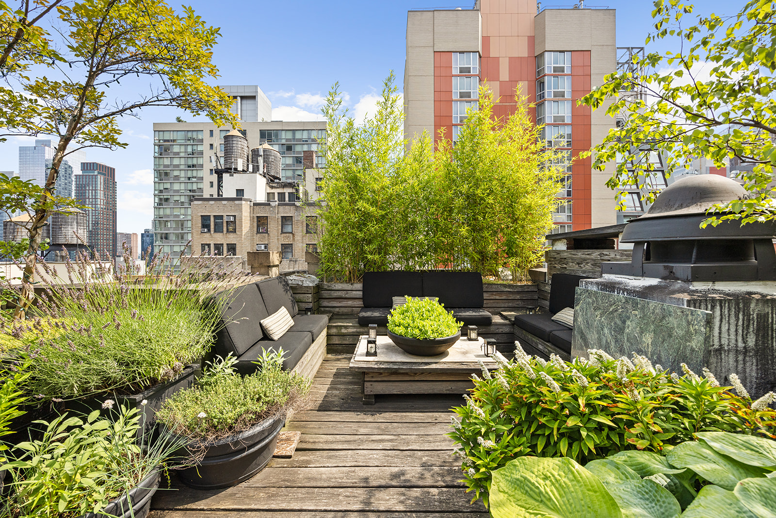 348 West 36th Street, Unit 6N Manhattan, NY 10018 - Photo 9 of 12 a view of a patio with couches table and chairs and potted plants