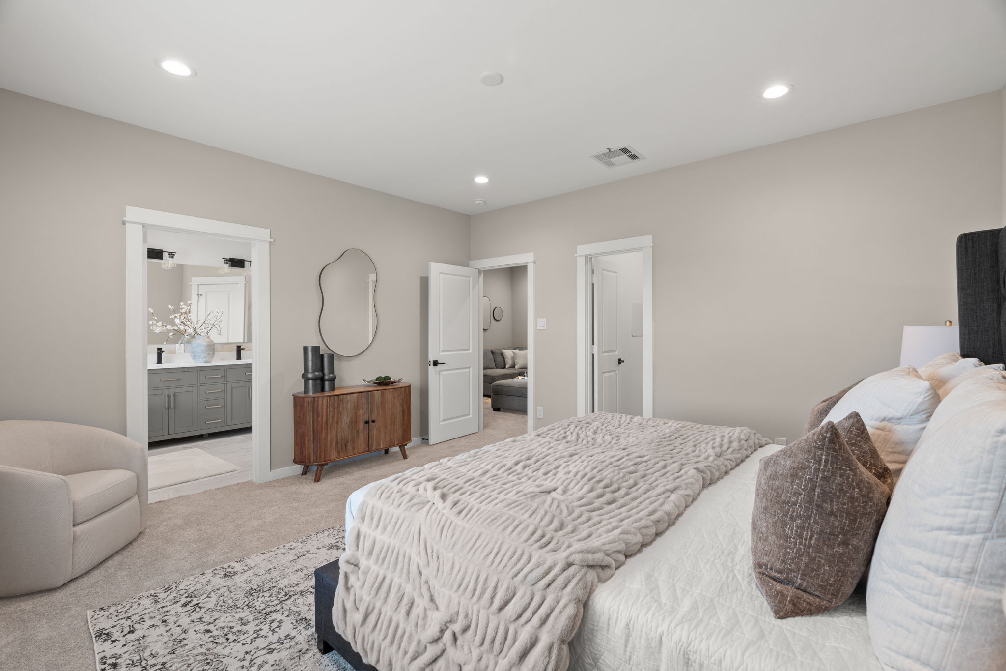 11303 Stonework Grv Lane Houston, TX 77076 - Photo 23 of 39 a spacious bedroom with a bed a couch and dresser