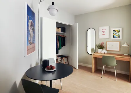 a workspace with furniture and window