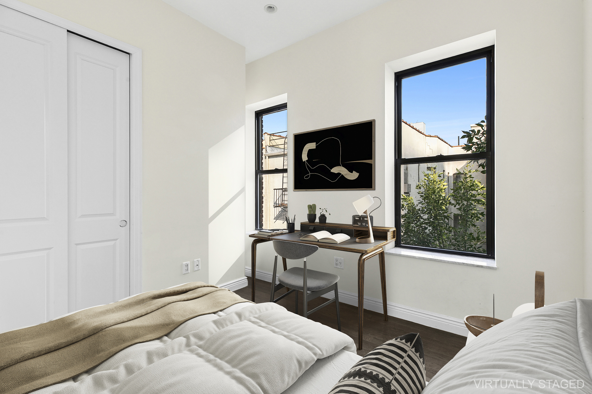 36 Linden Street, Unit 7D Brooklyn, NY 11221 - Photo 4 of 9 a bedroom with a bed and a flat screen tv