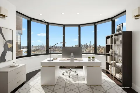 a dining hall with stainless steel appliances kitchen island granite countertop a sink and a refrigerator