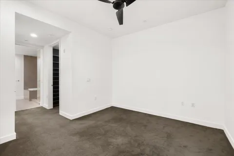 an empty room with wooden floor