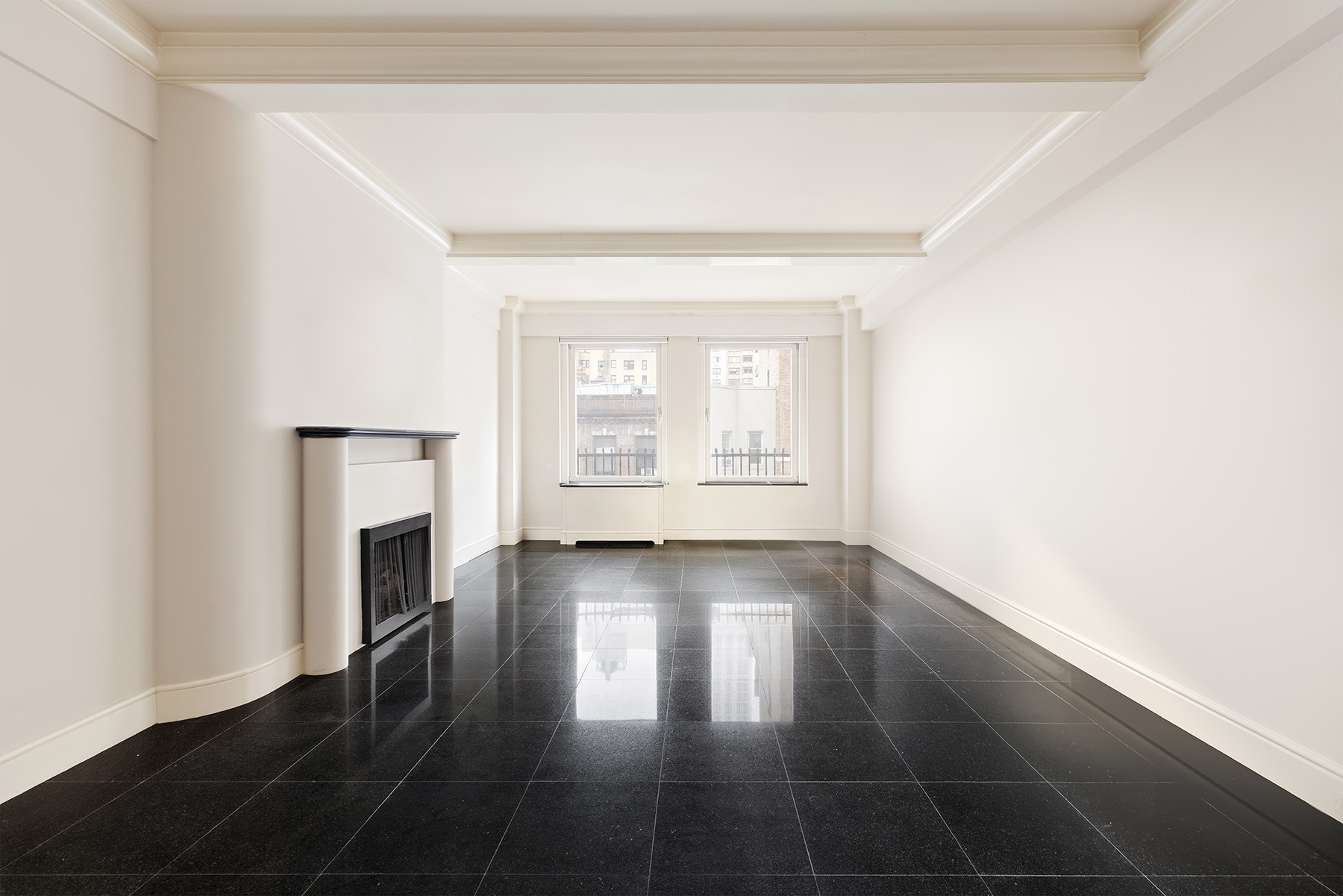 130 East 75th Street, Unit 4D Manhattan, NY 10021 - Photo 4 of 19 a view of a livingroom with wooden floor and a window