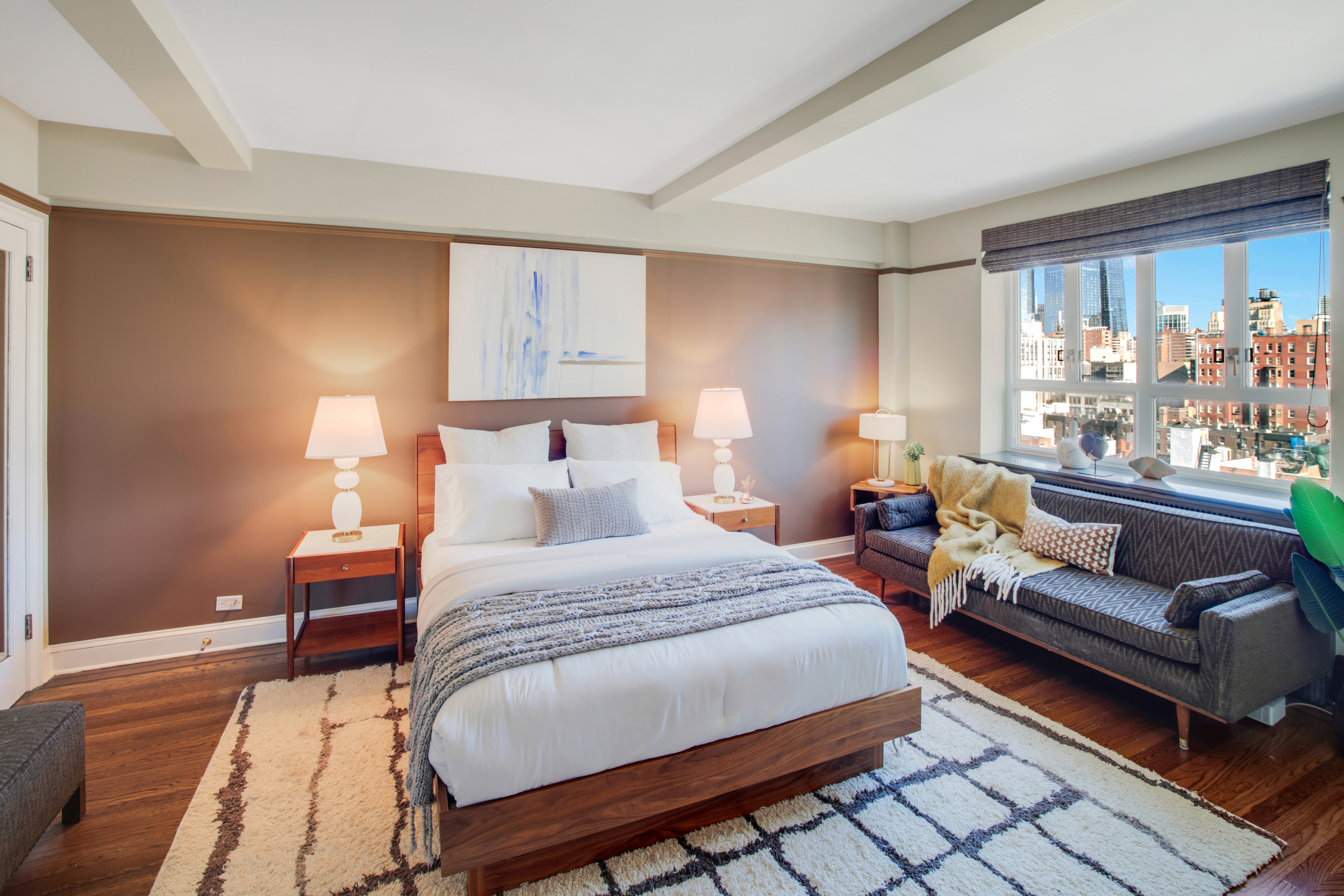 200 West 20th Street, Unit 1409/10 Manhattan, NY 10011 - Photo 8 of 15 a bedroom with a bed and a couch