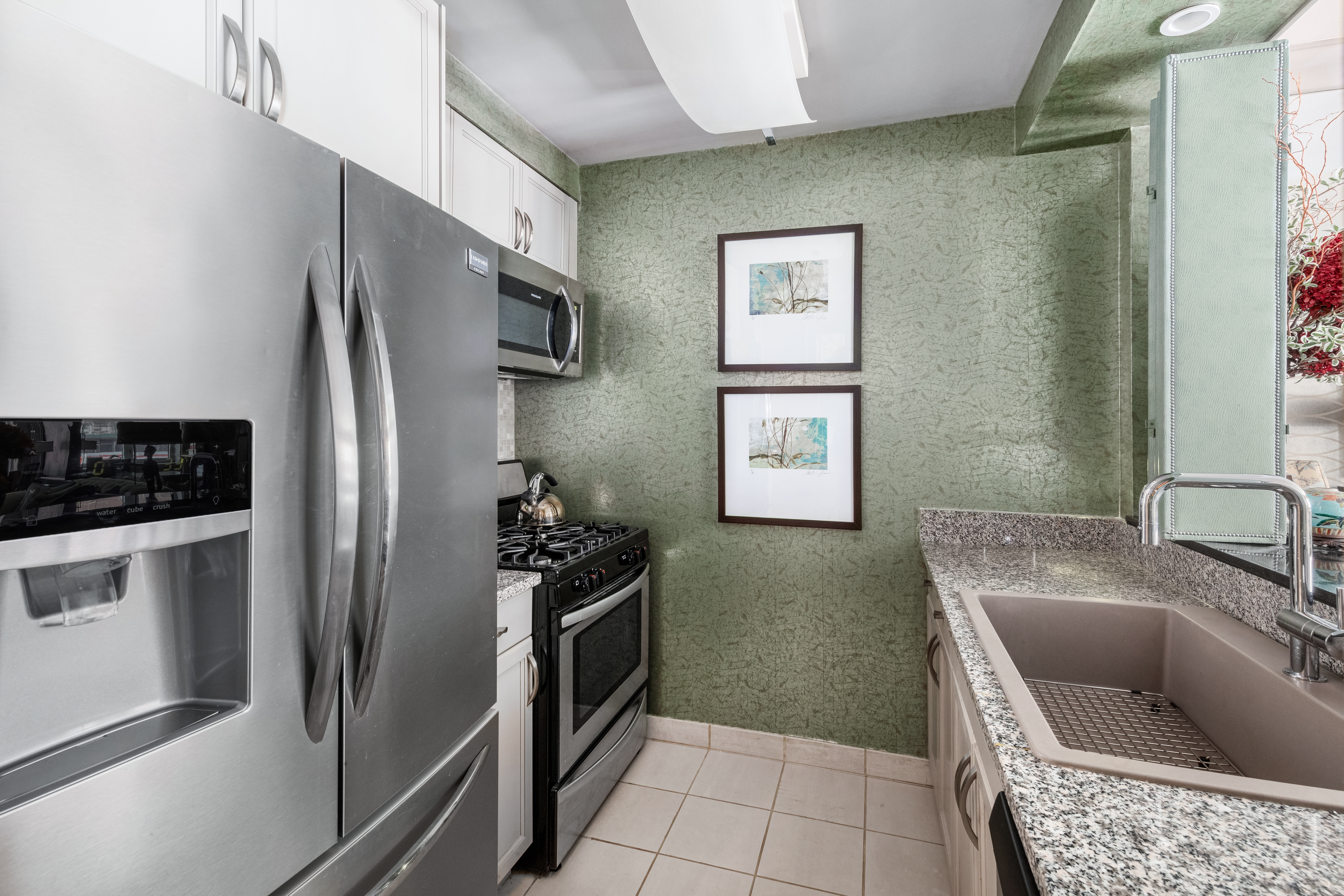 1760 2nd Avenue, Unit 2B Manhattan, NY 10128 - Photo 5 of 13 a kitchen with granite countertop a refrigerator and a sink