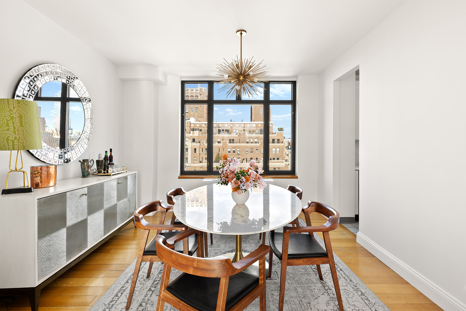 222 Riverside Drive, Unit PH2D Manhattan, NY 10025 - Photo 3 of 11 a dining room with furniture a chandelier and wooden floor