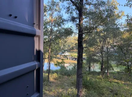 a view of swimming pool with furniture