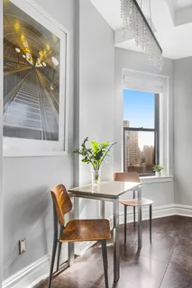 a dining room with furniture and window