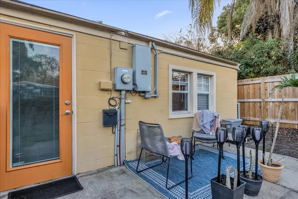 a patio with table and chairs