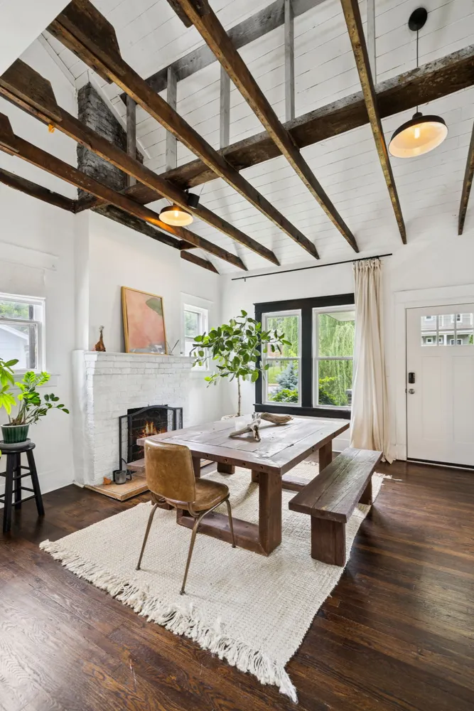a workspace with furniture window and wooden floor