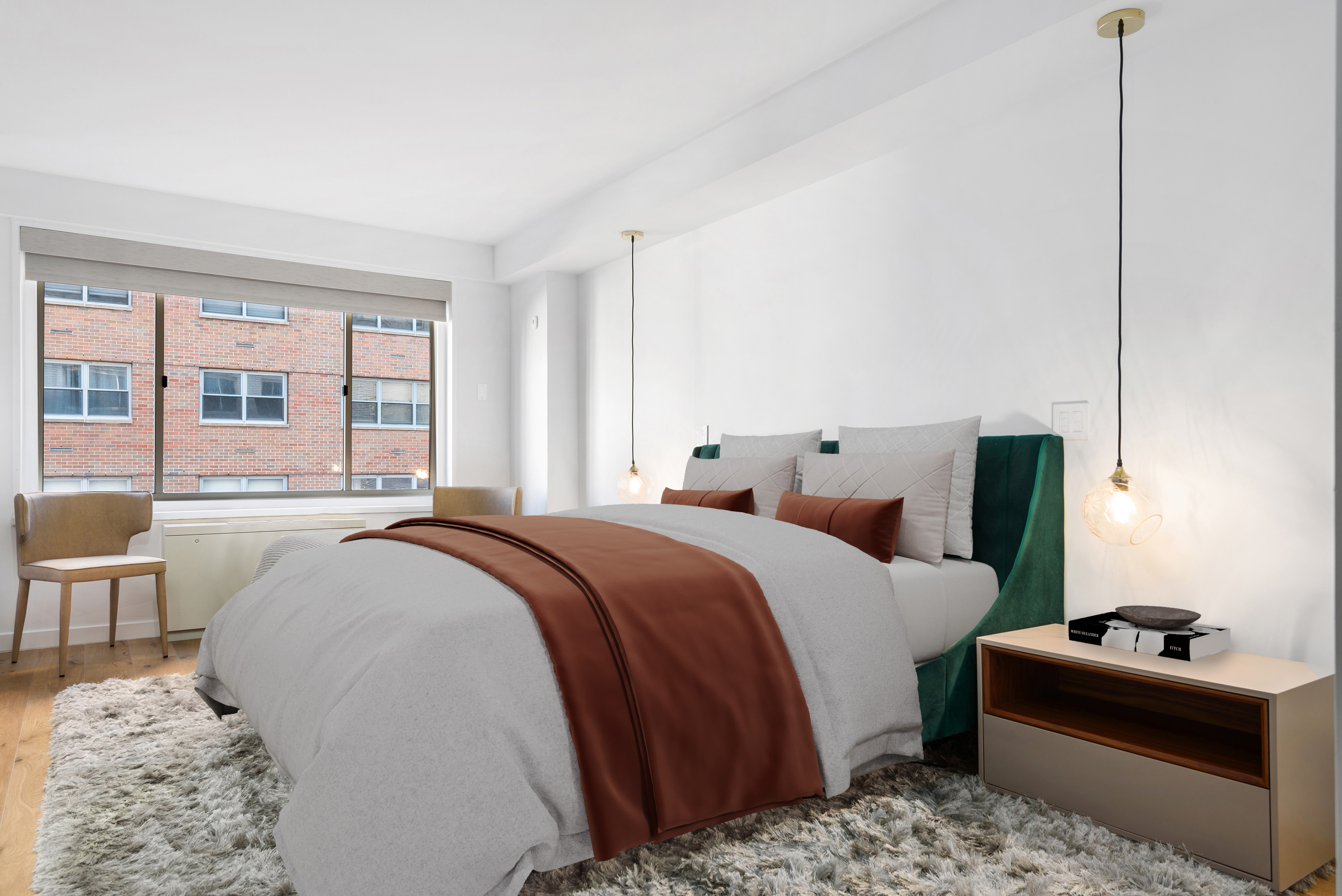 30 East 65th Street, Unit 6B Manhattan, NY 10065 - Photo 6 of 14 a bed room with a bed and a couch