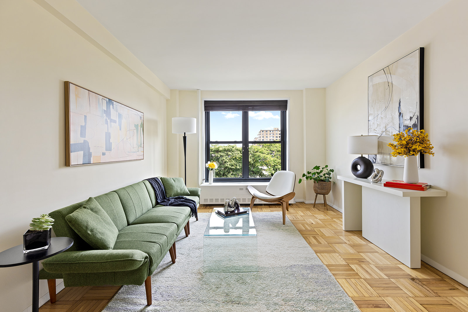 a living room with furniture and a window
