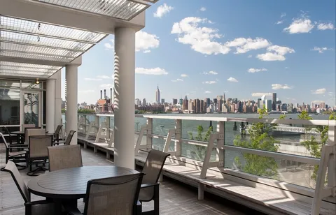 a living room with lots of furniture and a chandelier