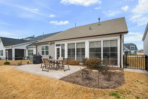 a front view of a house with outdoor seating