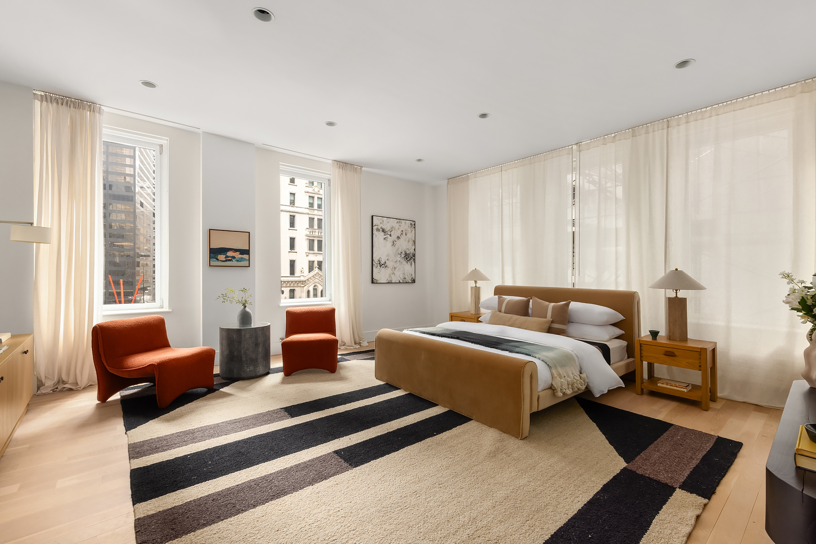 114 Liberty Street, Unit 7 Manhattan, NY 10006 - Photo 9 of 15 a spacious bedroom with a bed and a couch