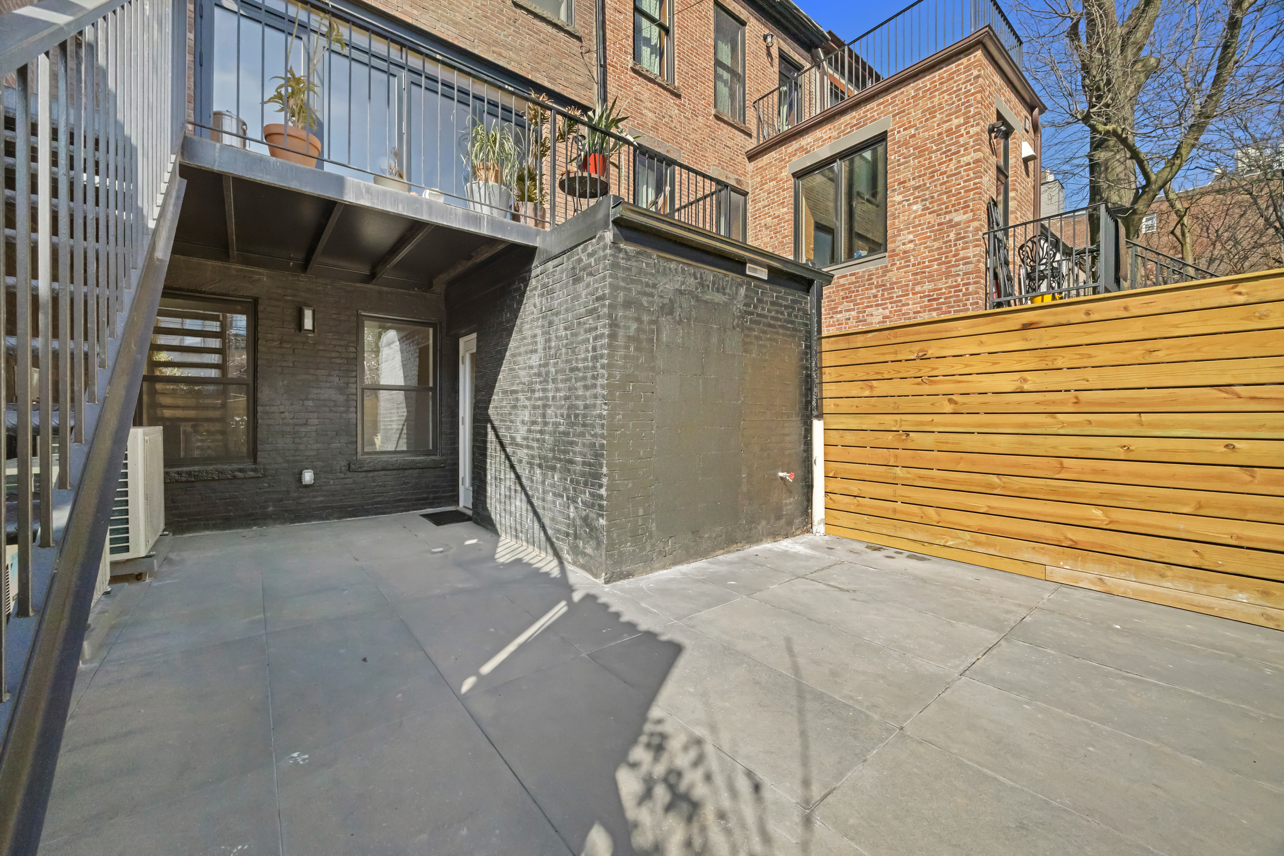 544 Madison Street, Unit A Brooklyn, NY 11221 - Photo 16 of 17 a view of a house with a outdoor space