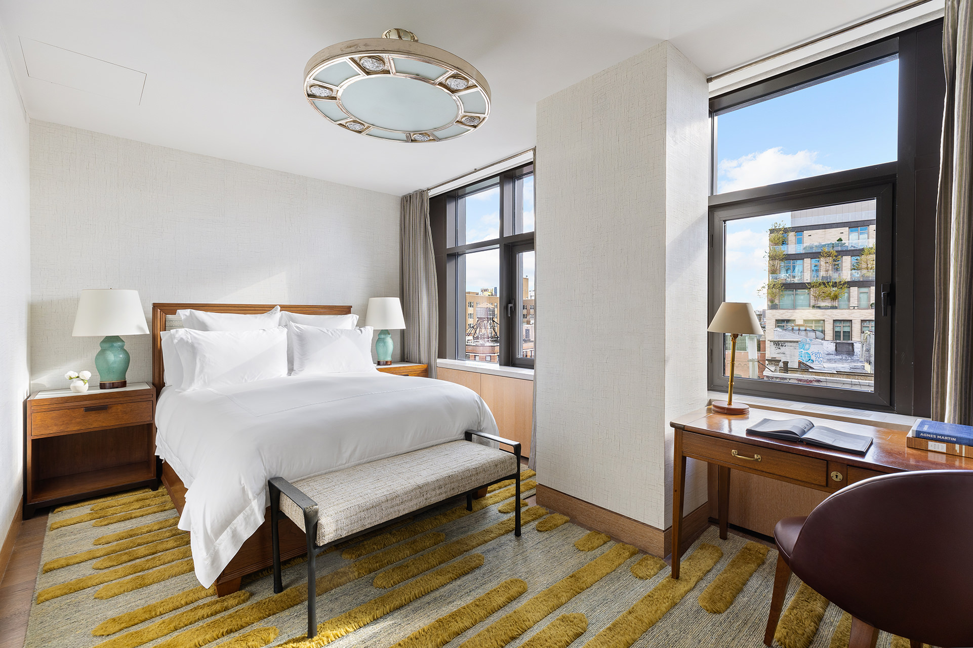 25 Bond Street, Unit PHW Manhattan, NY 10012 - Photo 21 of 34 a bedroom with a bed and window