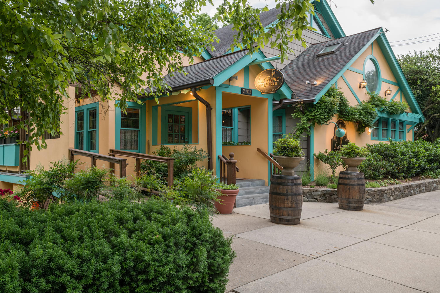 6815 Delaware Street Chevy Chase, MD 20815 - Photo 32 of 34 a front view of a house with garden