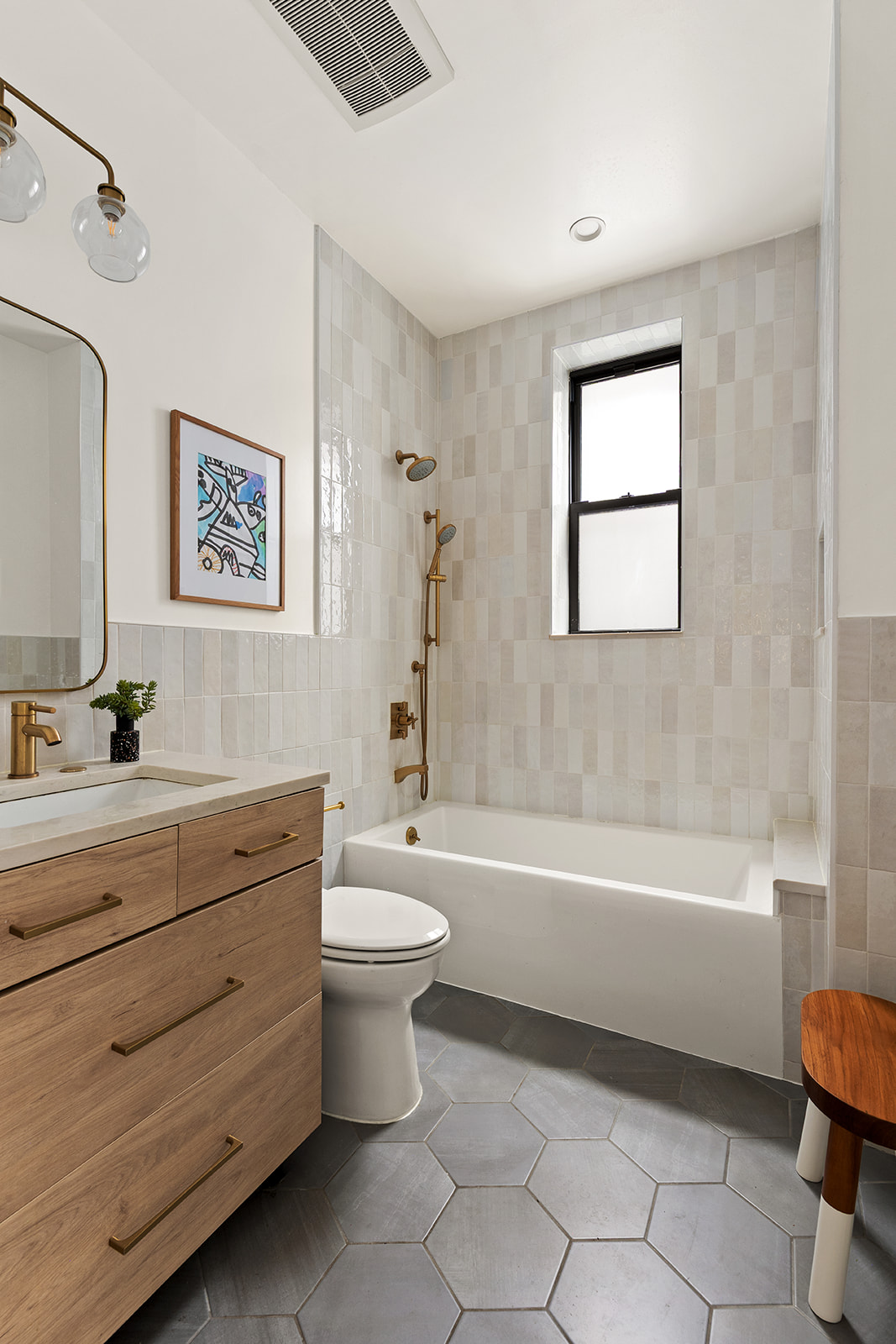 551 4th Street, Unit 1L Brooklyn, NY 11215 - Photo 10 of 17 a bathroom with a bathtub a sink a toilet and a window